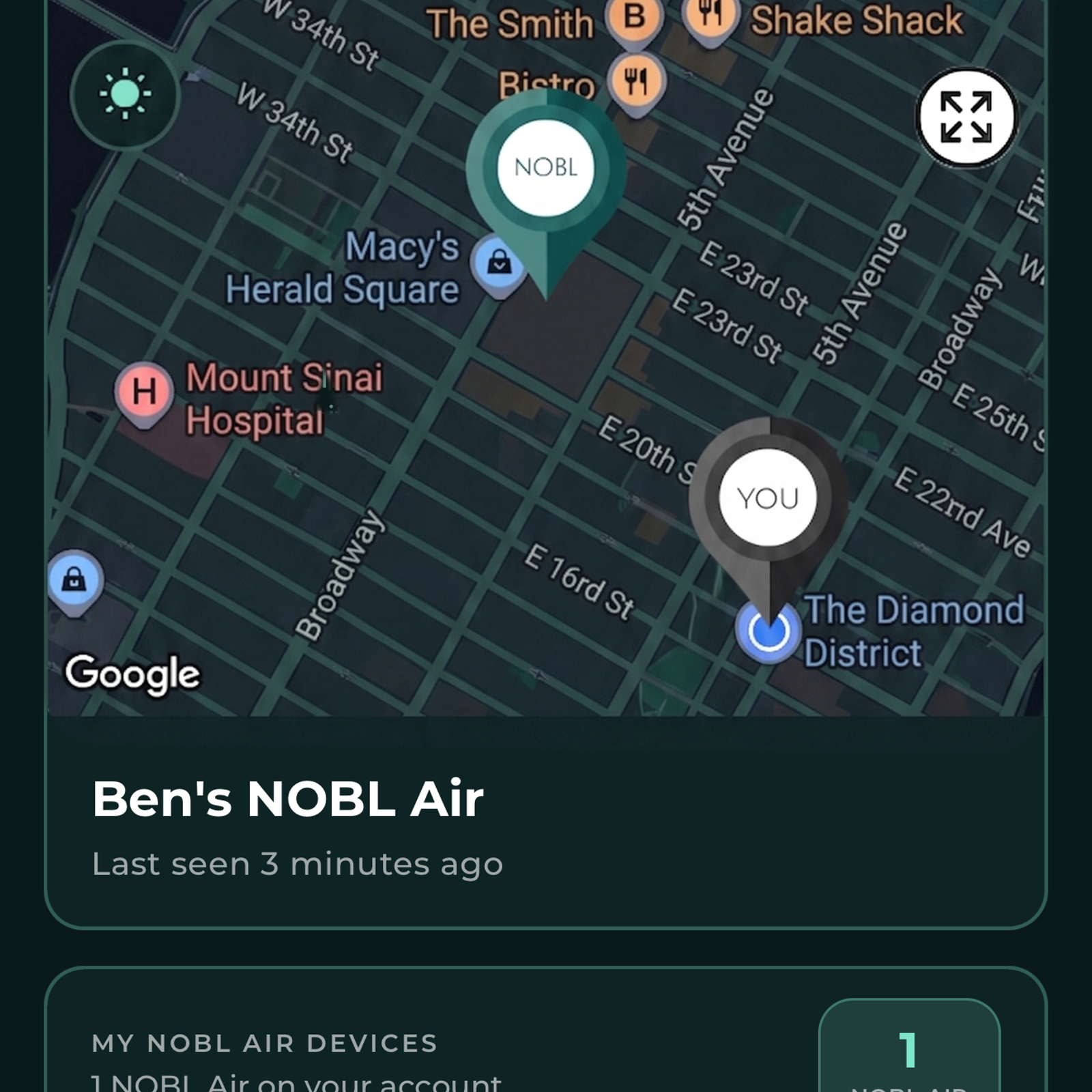 NOBL Air app showing the suitcase location on a phone beside the NOBL carry-on
